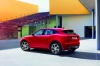 2019 Jaguar E-Pace P300 R-Dynamic AWD in Firenze Red Metallic from a rear left three-quarter view